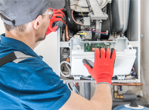 Man inspecting inside of a furnace